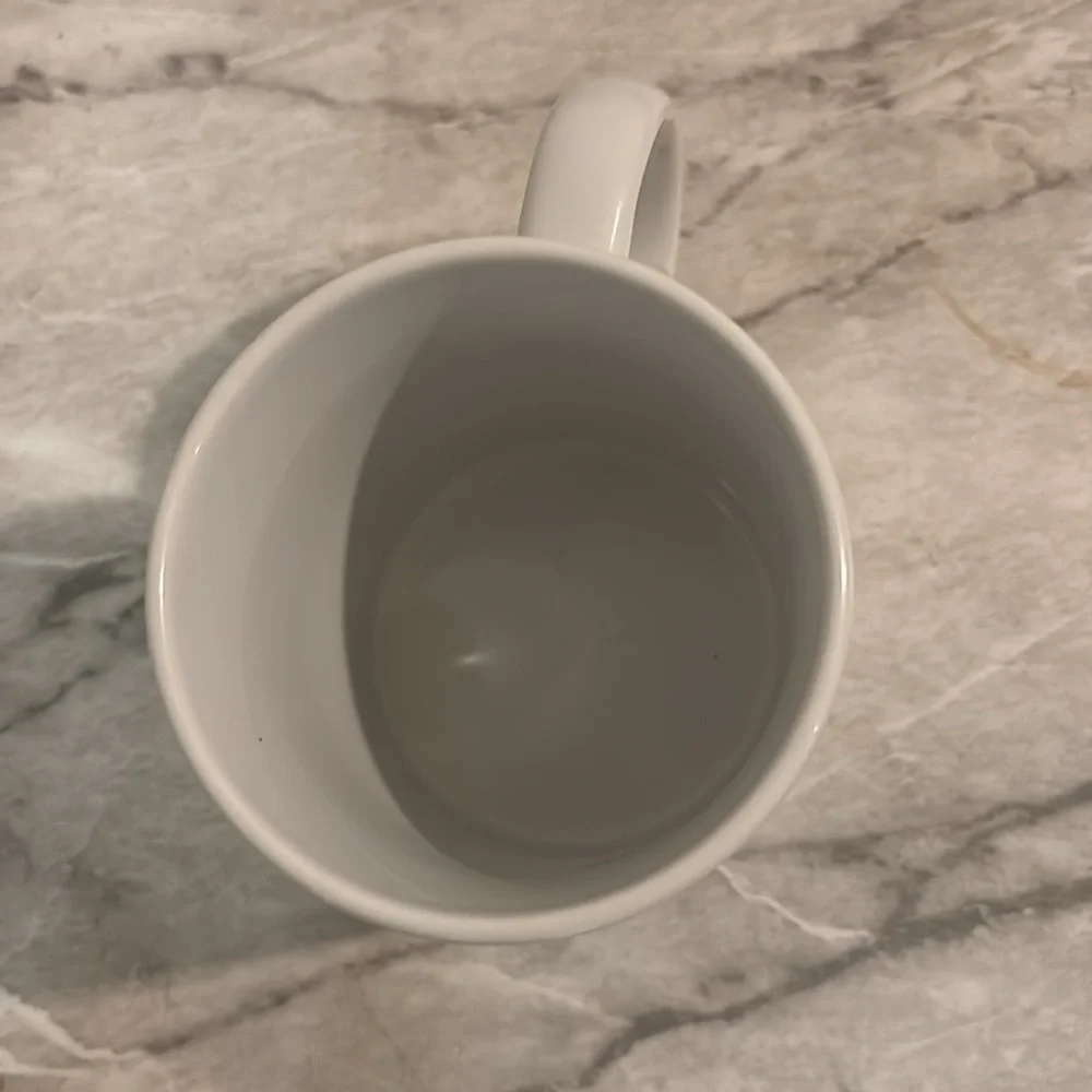 This might be vodka, coffee mug 14 ounce no chips, cracks or stains